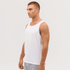 A white singlet displayed on a model, featuring a simple design and sleeveless cut. The model has a neutral expression.