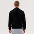 A black hooded sweatshirt viewed from the back, featuring a simple design and a hood.
