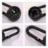 A black carabiner featuring a compass and thermometer, with bold red and blue indicators. The product has a metallic hook.