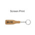 A drink bottle-shaped cork keyring with a silver chain and a logo. The cork has a natural texture.