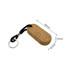 An oval cork keyring in a natural brown colour, featuring a black rope and metal keyring attachment.