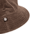 A brown corduroy bucket hat with a logo tag on the side. The texture is clearly visible in the image.