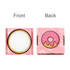 A pink gift box with a round window and a donut graphic on one side, featuring a playful design.