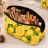 A yellow neoprene cosmetic bag filled with makeup brushes and various cosmetic products, featuring a lemon design.