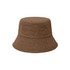 A brown dual-material reversible bucket hat with a textured surface and a wide brim. It features a logo.