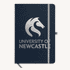 A navy A5 notebook with a branded logo on the cover and an elastic band closure.