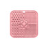 A pink, four-section dog enrichment lick mat featuring various textured patterns, including paw prints and bones, with a central hole.