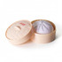 A squishy bun in a round, light peach container with a lid, featuring a soft purple bun inside.