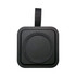 A black wireless charging station with a rounded centre, featuring a leather strap for easy handling.