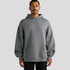 A grey hooded sweatshirt with a front pocket, featuring a relaxed fit and long sleeves. It has a logo on the sleeve.