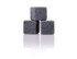 A set of three grey granite drink stones, designed for chilling beverages without dilution.
