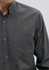 A black and grey patterned long sleeve button-up shirt with a single chest pocket and a logo.