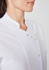A white women's jacket with a stand-up collar and decorative buttons, featuring a sleek and professional design.