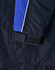 A close-up of a navy jacket featuring blue and white detailing, with a Velcro cuff closure. It has a logo on it.