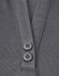 A close-up of a grey polo shirt featuring a placket with two black buttons and a sustainable fabric blend.