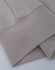 A light beige crew fleece jumper with a smooth texture and cuffed sleeves. It features a logo on the fabric.