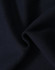 A close-up of dark navy fabric, showcasing the soft texture of a fleecy hoodie material.