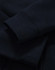 A close-up of a navy full-zip fleecy hoodie showcasing the cuffs and fabric texture. It has a logo.
