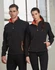 A black softshell jacket with orange accents, featuring a zippered front and pockets, displayed on a male and female model.
