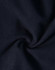 A close-up view of dark navy softshell fabric, featuring a smooth texture with a slight sheen.