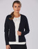 A navy blue women's 100% merino wool long sleeve cardigan with buttons, worn over a white top.