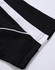A close-up of a black polo shirt featuring white accents and a logo.