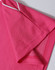 A close-up of a pink polo shirt featuring short sleeves and contrasting trim. The shirt includes a logo.