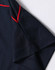 A navy polo shirt featuring red piping along the collar and sleeves. The fabric appears breathable and lightweight.