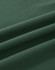 A close-up view of soft, dark green cotton fabric, featuring gentle folds and a smooth texture.