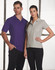 A purple men's polo shirt and a grey women's polo shirt displayed on models. Both styles feature a logo.