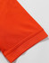 An orange polo shirt featuring a textured fabric and a folded sleeve hem. It includes a logo on the garment.