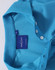 A light blue polo shirt featuring a collar and button placket, with a branded label inside.