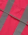 A pink safety vest featuring grey reflective shoulder tapes, designed for visibility and safety.