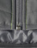 A quilted grey safety jacket with reflective stitching and a zipper detail at the front, including a logo.