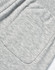 A close-up of grey poly/cotton terry sweat pants featuring a single back pocket and elastic waistband.