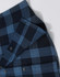 A unisex flannel plaid shirt in dark blue tones, featuring button-up closure and a visible logo.