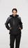 A black and grey jacket with a hood, featuring a zipped front and side pockets, displayed on a model.
