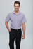 A short sleeve button-up shirt in a light purple hue, presented on a model with a belt and dark trousers.