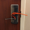 Red Team Tools Deadbolt Strap Installed on the Inside of a Hotel Room Door