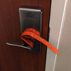 Red Team Tools Deadbolt Strap Installed on the Inside of a Hotel Room Door