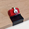 MikeDev lock stand attached with binder clip to wooden workbench top