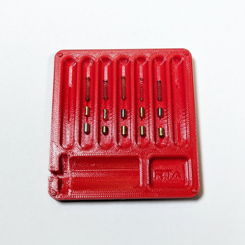 Pinning tray with a series of pin stacks laid out for examination