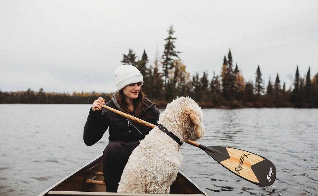 dogIDs Customer and Pupstomer Canoeing Across a Northern Minnesota Lake