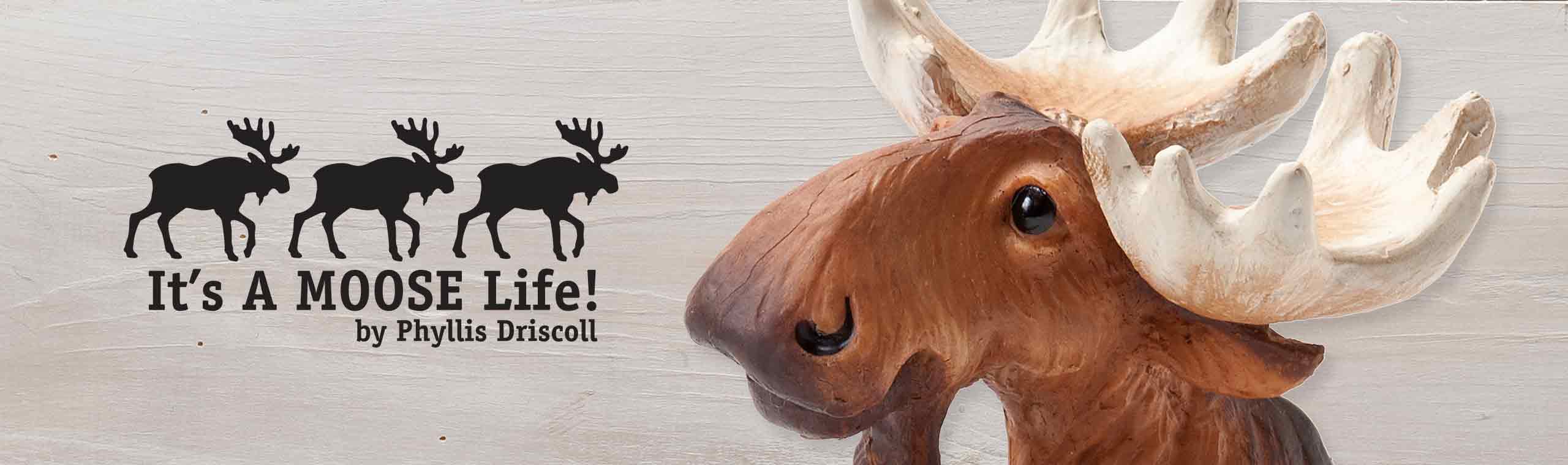 Its a moose life banner by Phyllis Driscoll and a zoomed up picture of a moose