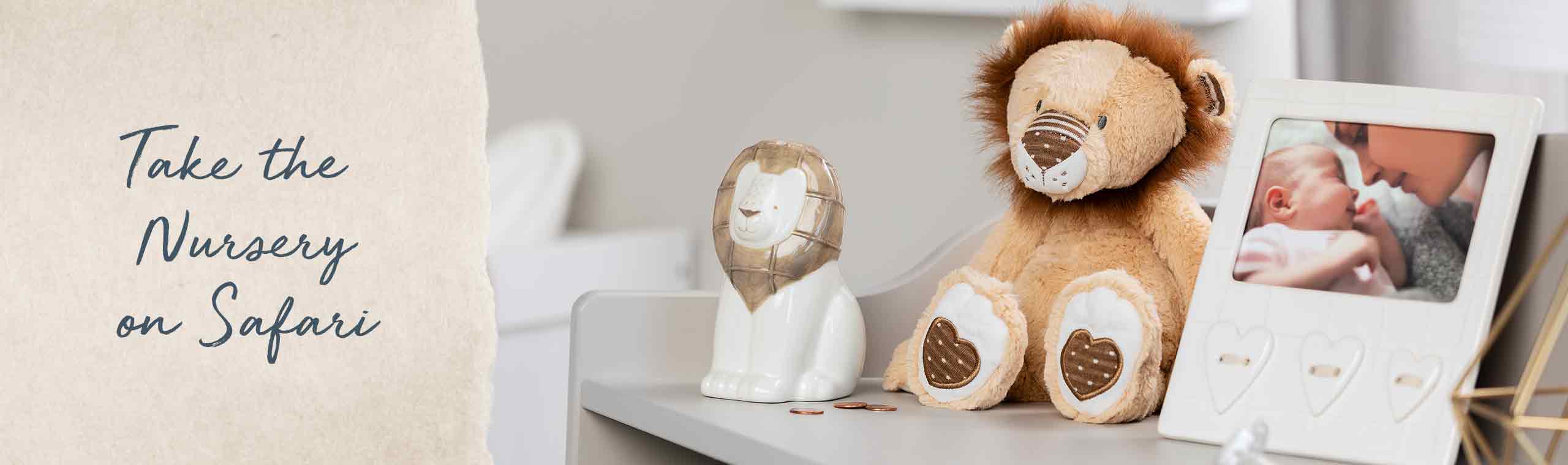 Take the Nursery on a Safari! a Photo of a stuffed lion next to a baby frame