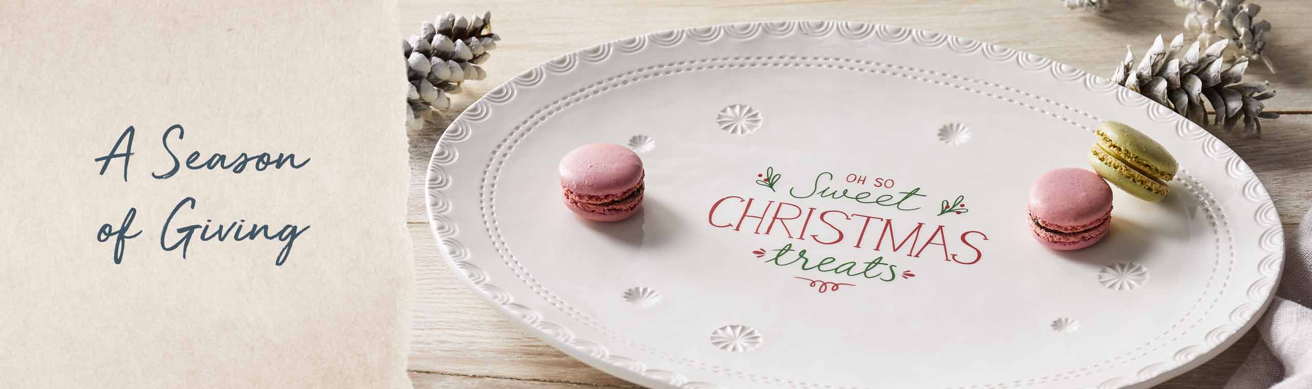 A season of Giving! a ceramic christmas plate with some food on top