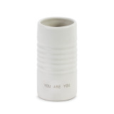 Small white ridged vase with the words You are You at the base
