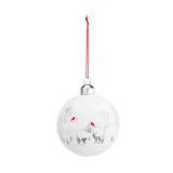A white ball ornament with a winter deer scene and red cardinals etched into the surface. With a red string.