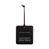 A square black hanging ornament that says "Where America is Still Wild" in white under two white lines with room for personalization.