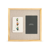 A light wood frame with a tile on the left that has a watercolor image of three hummingbirds, next to a 4x6 photo opening with a linen mat.
